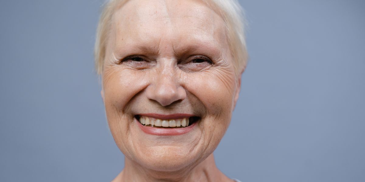 A close portrait of a smiling older woman